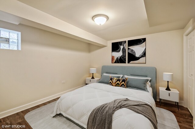 bedroom featuring dark wood-type flooring