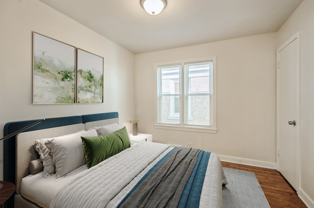 bedroom featuring dark hardwood / wood-style flooring