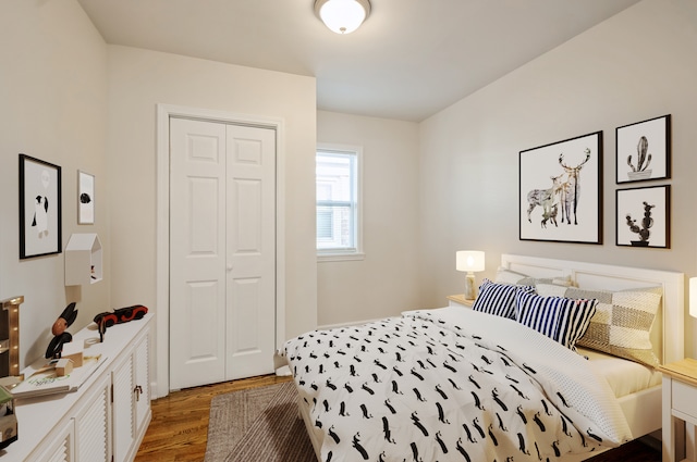 bedroom featuring a closet and hardwood / wood-style floors