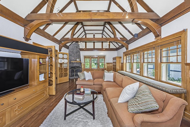 living room with dark hardwood / wood-style flooring, a brick fireplace, beam ceiling, and high vaulted ceiling