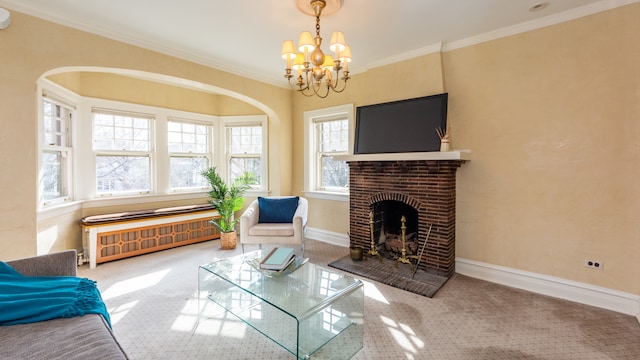 living room with radiator, a fireplace, ornamental molding, and a chandelier