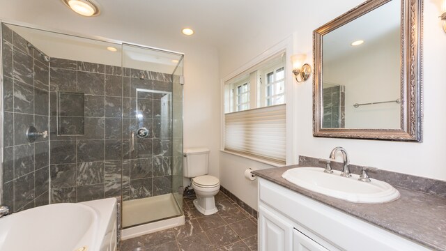 full bathroom featuring vanity, toilet, and shower with separate bathtub