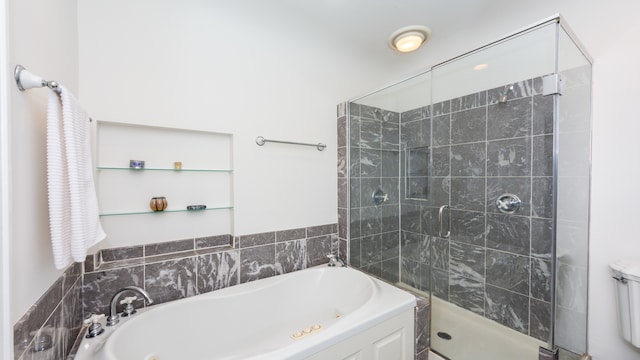 bathroom featuring separate shower and tub