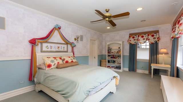 carpeted bedroom featuring crown molding and ceiling fan