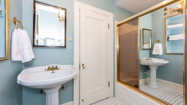 bathroom with tile patterned flooring and enclosed tub / shower combo