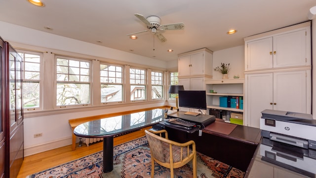 office space featuring ceiling fan and light wood-type flooring