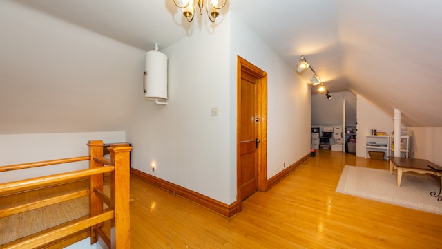 additional living space with lofted ceiling and light hardwood / wood-style floors