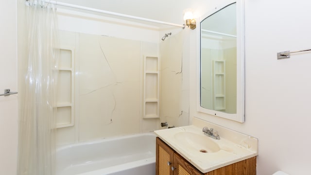 bathroom with vanity and  shower combination