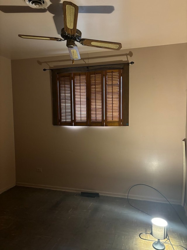 spare room with ceiling fan