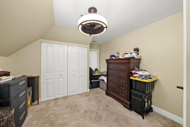 carpeted office featuring lofted ceiling