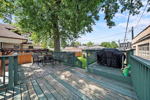 wooden deck with area for grilling