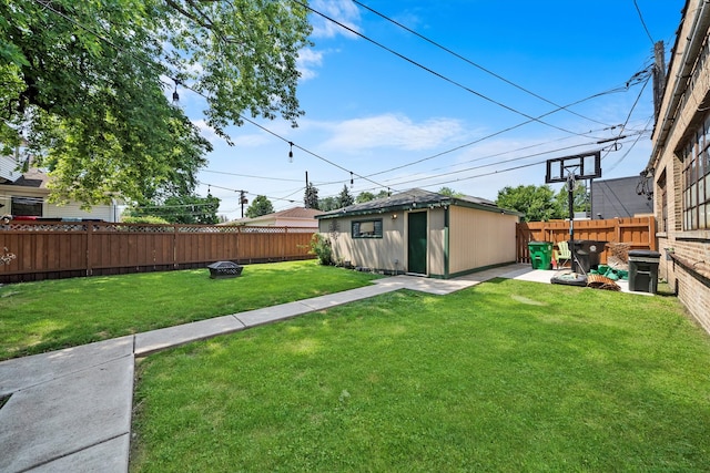 view of yard featuring a storage unit and a patio