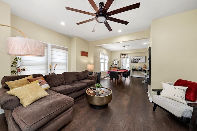 living room with ceiling fan and hardwood / wood-style flooring