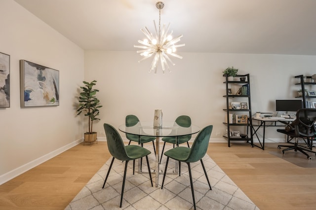 dining area with an inviting chandelier and light wood-type flooring