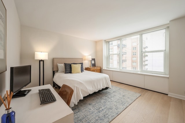 bedroom featuring light hardwood / wood-style floors