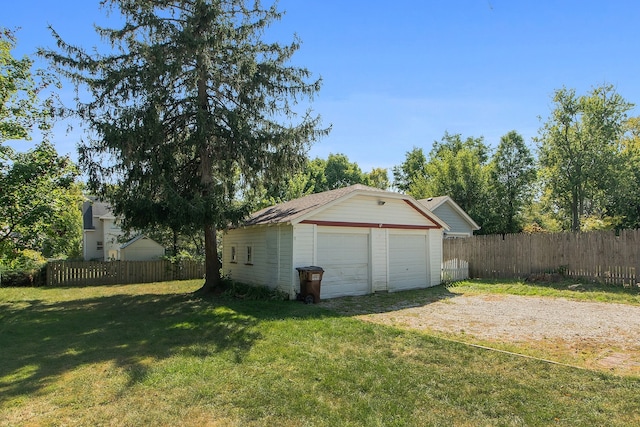 garage with a yard