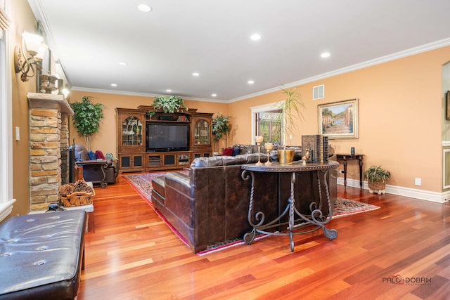 living room featuring wood-type flooring and crown molding