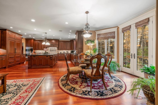 dining area featuring crown molding, french doors, and dark hardwood / wood-style floors