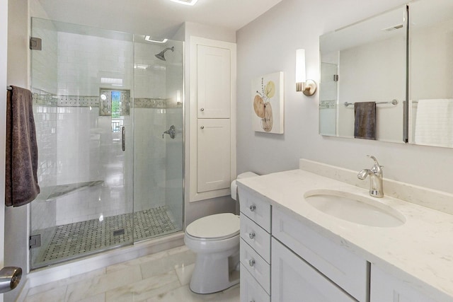 bathroom featuring an enclosed shower, vanity, and toilet