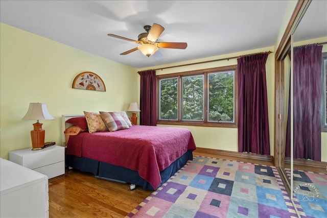 bedroom featuring hardwood / wood-style floors and ceiling fan