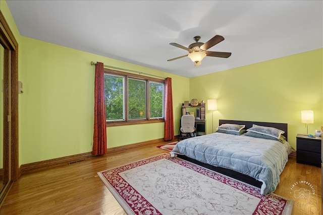 bedroom featuring light hardwood / wood-style floors and ceiling fan