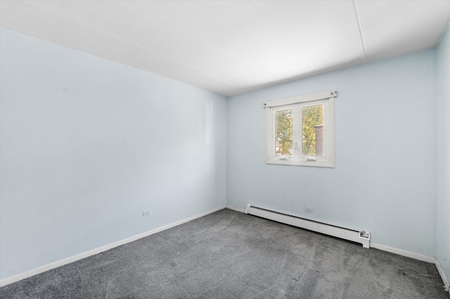 carpeted spare room with a baseboard radiator