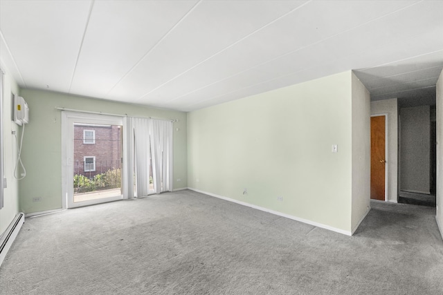 unfurnished room featuring a baseboard radiator, carpet floors, and an AC wall unit