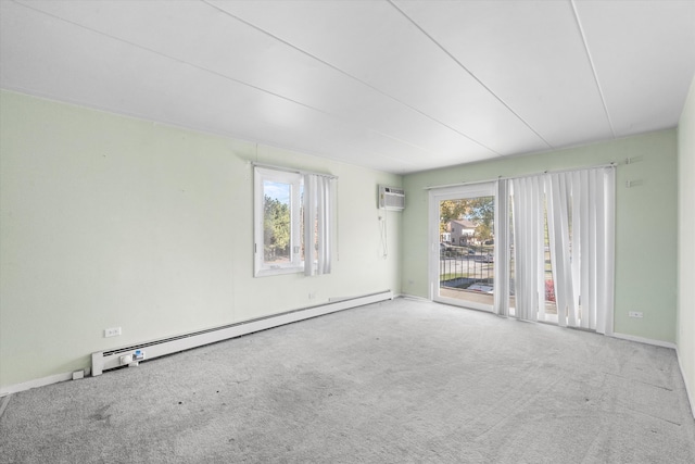 spare room with carpet flooring, a baseboard radiator, and a wall mounted AC