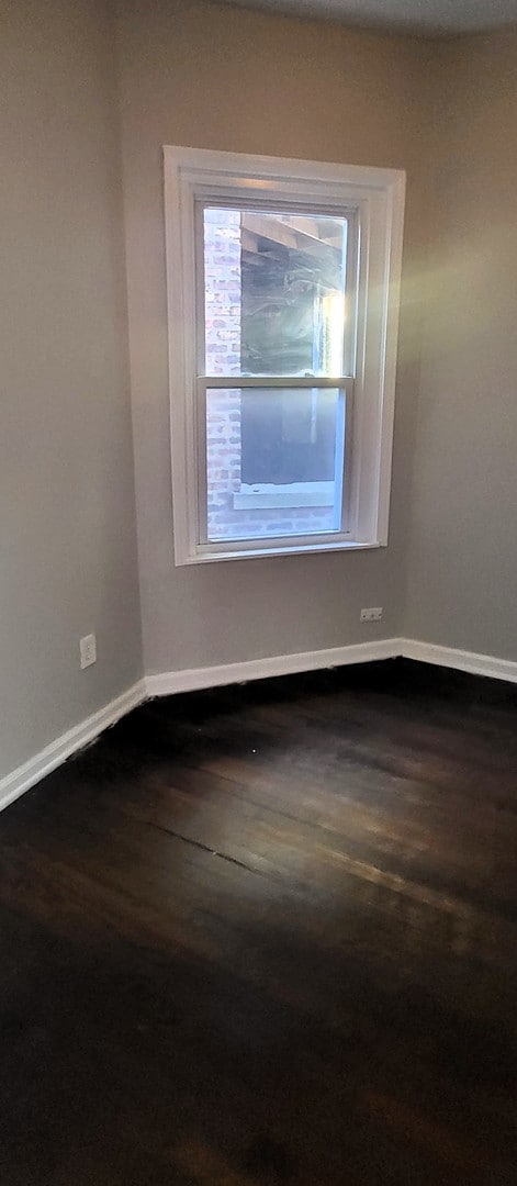 empty room featuring hardwood / wood-style flooring