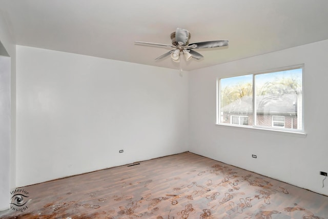 spare room with ceiling fan and light hardwood / wood-style flooring