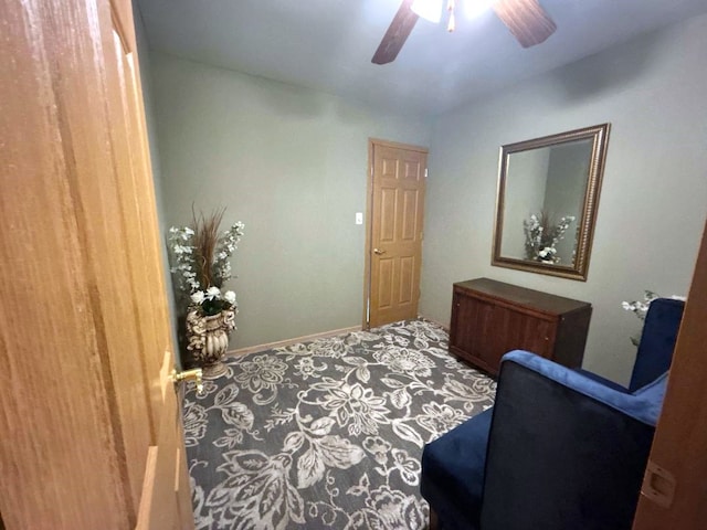 bedroom featuring ceiling fan and carpet floors