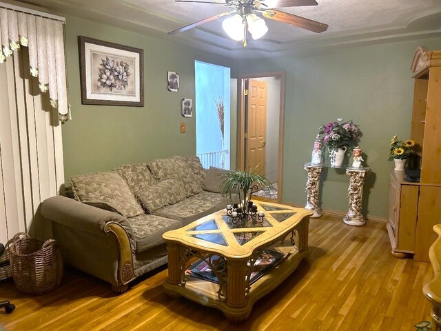 16409 Craig Dr, Oak Forest, IL 60452 - living area featuring wood finished floors, a ceiling fan, and baseboards