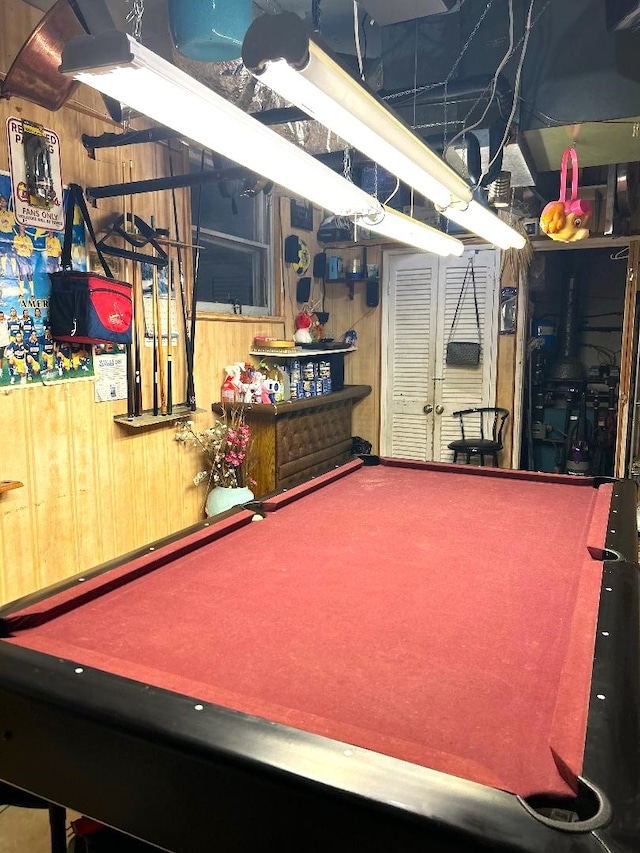 playroom with billiards and wooden walls