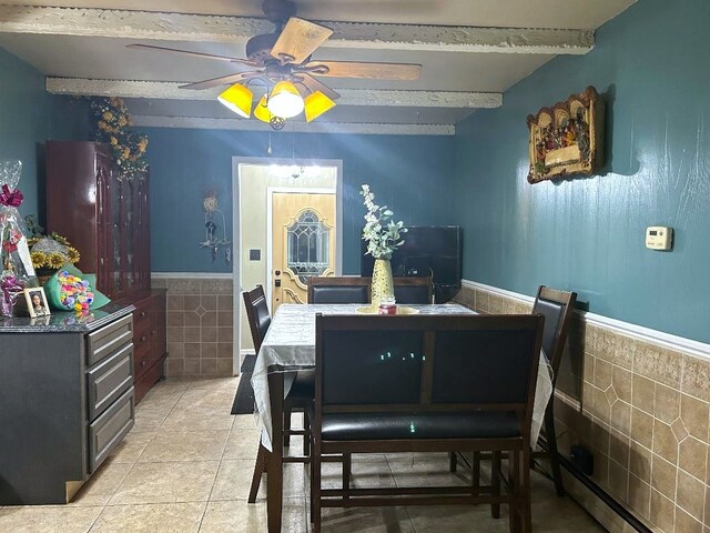 16409 Craig Dr, Oak Forest, IL 60452 - dining room with a ceiling fan, tile walls, a wainscoted wall, light tile patterned floors, and baseboard heating