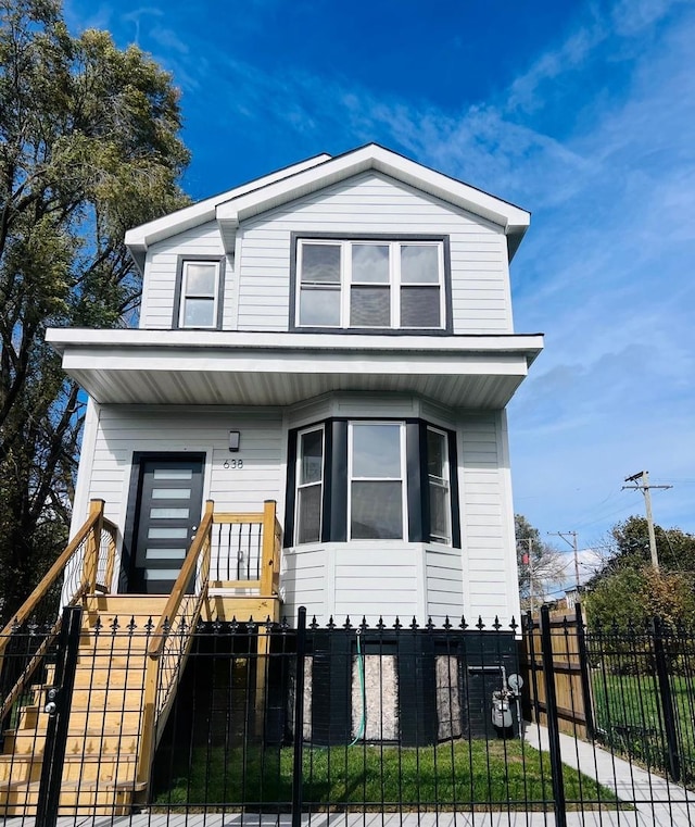 638 E 65th St, Chicago, IL 60637 - view of front of property featuring stairway, a porch, and a fenced front yard