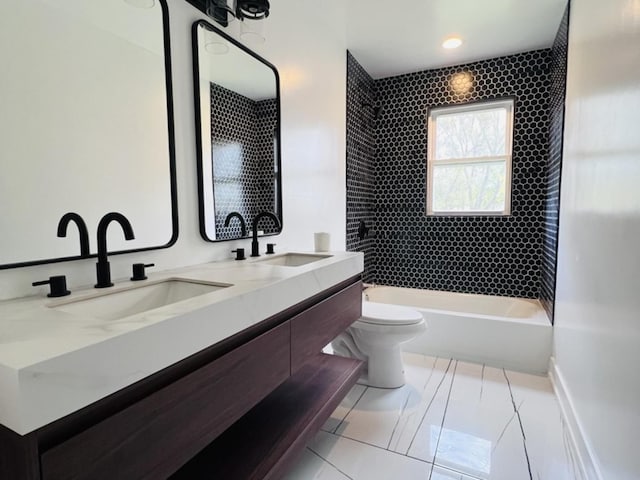 638 E 65th St, Chicago, IL 60637 - full bath featuring toilet, double vanity, shower / tub combination, and tile patterned flooring