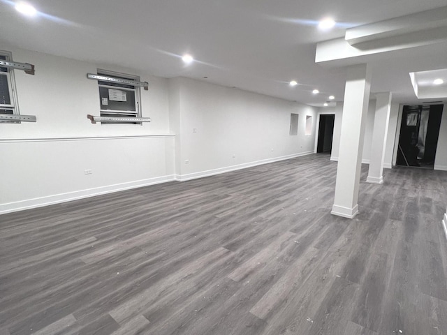 basement featuring dark hardwood / wood-style flooring