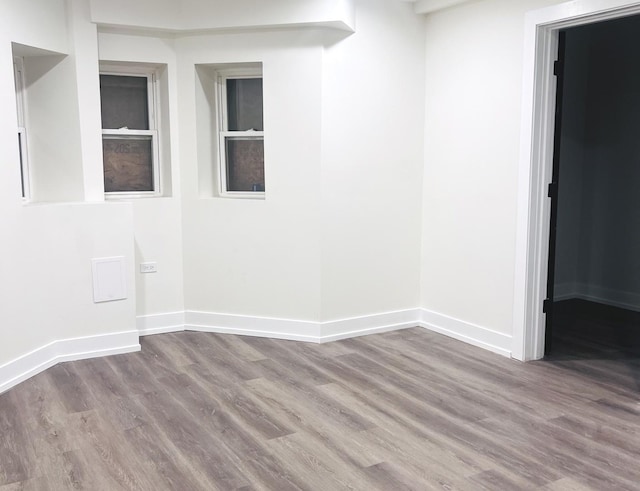 unfurnished room featuring hardwood / wood-style flooring