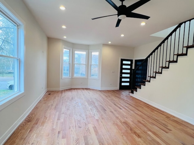 entryway with ceiling fan and light hardwood / wood-style floors