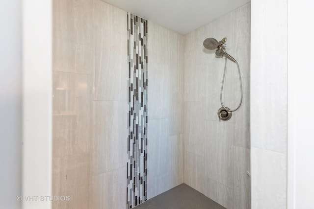 bathroom with tiled shower