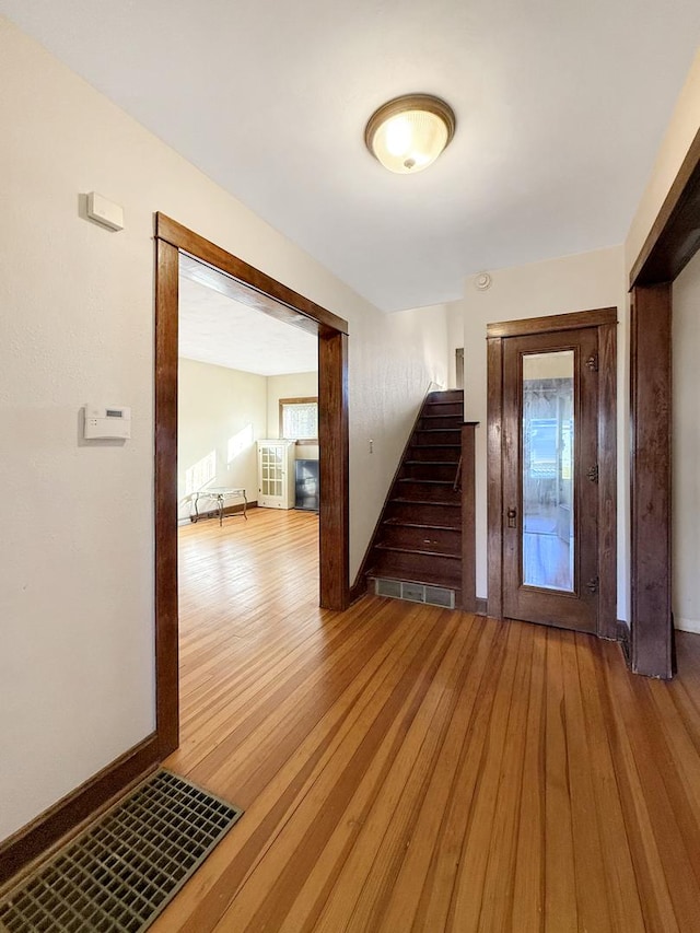 103 E Roosevelt St, Freeport, IL 61032 - foyer with light wood finished floors, stairs, and baseboards