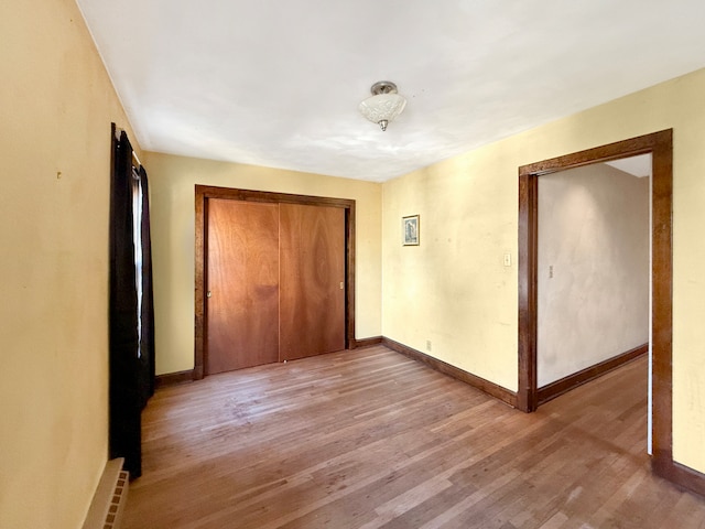 interior space with a closet and light hardwood / wood-style flooring