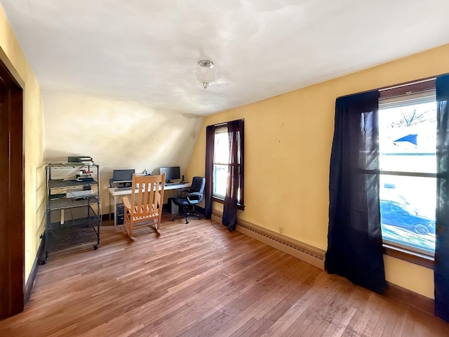 103 E Roosevelt St, Freeport, IL 61032 - home office featuring a baseboard heating unit, hardwood / wood-style flooring, and baseboards