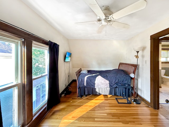 bedroom with hardwood / wood-style floors and ceiling fan