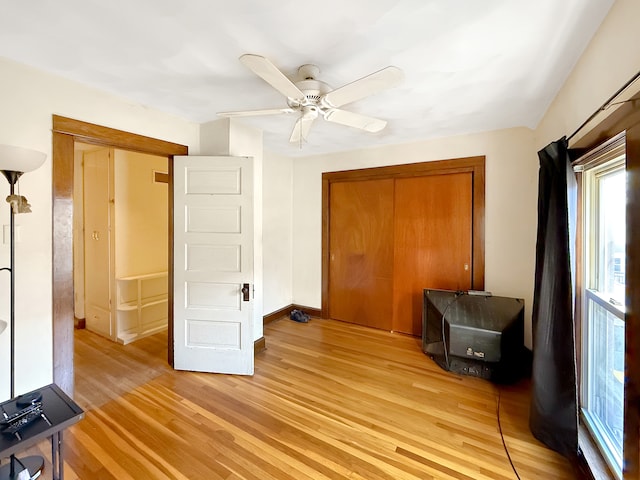 bedroom featuring a closet, ceiling fan, and light hardwood / wood-style floors