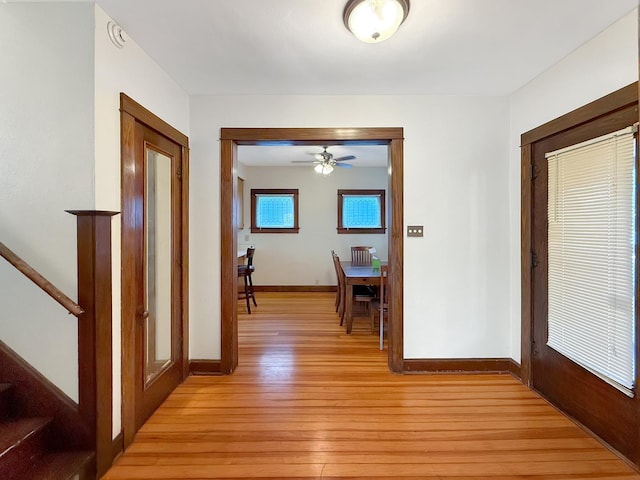 103 E Roosevelt St, Freeport, IL 61032 - corridor with light wood-style floors, baseboards, and stairs