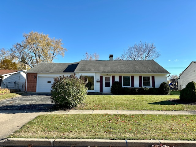 single story home with a front yard and a garage