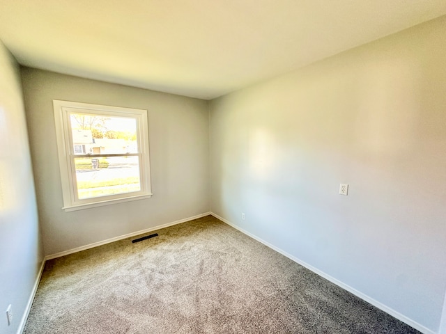 empty room featuring carpet flooring