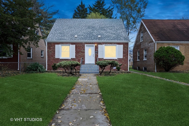 view of front of home with a front lawn