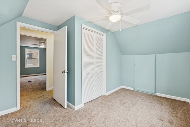 additional living space with light carpet, vaulted ceiling, and ceiling fan